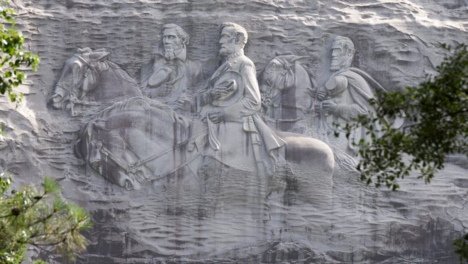 A June 23, 2015 file photo shows the "Confederate Memorial Carving", depicting confederates Stonewall Jackson, Robert E. Lee and Jefferson Davis, in Stone Mountain, Ga.