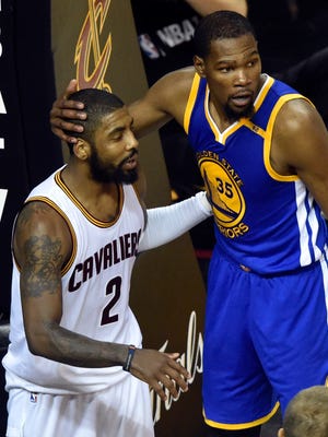 Golden State Warriors forward Kevin Durant (35) and Cleveland Cavaliers guard Kyrie Irving (2) react during the fourth quarter in Game 4 of the Finals.