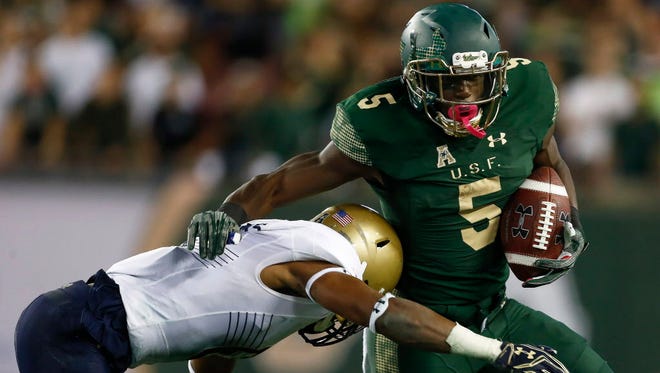 South Florida running back Marlon Mack (5) runs the ball in the first half against Navy.