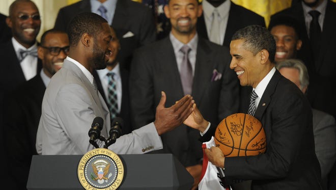 Dwyane Wade shaking hands with President Obama as the White House honors the NBA champion Miami Heat.
