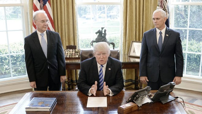 President Trump with HHS Secretary Tom Price and Vice President Pence after Obamacare repeal bill was pulled from the House floor, Washington, March 24, 2017.