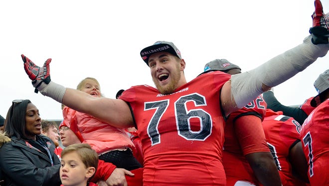 Dec 3, 2016; Bowling Green, KY, USA; Western Kentucky Hilltoppers offensive lineman Forrest Lamp (76) celebrates his teams victory following the CUSA championship game against the Louisiana Tech Bulldogs at Houchens Industries-L.T. Smith Stadium. Western Kentucky won 58-44. Mandatory Credit: Jim Brown-USA TODAY Sports ORG XMIT: USATSI-354358 ORIG FILE ID:  20161203_pjc_ab2_164.JPG