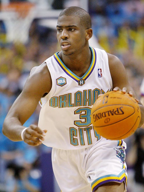 2006: New Orleans Hornets guard Chris Paul (3) dribbles the ball against the Golden State Warriors.