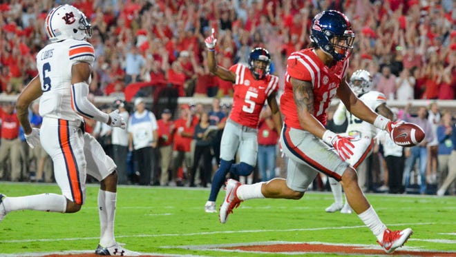 Mississippi tight end Evan Engram (17) scores a touchdown during the first quarter against Auburn.