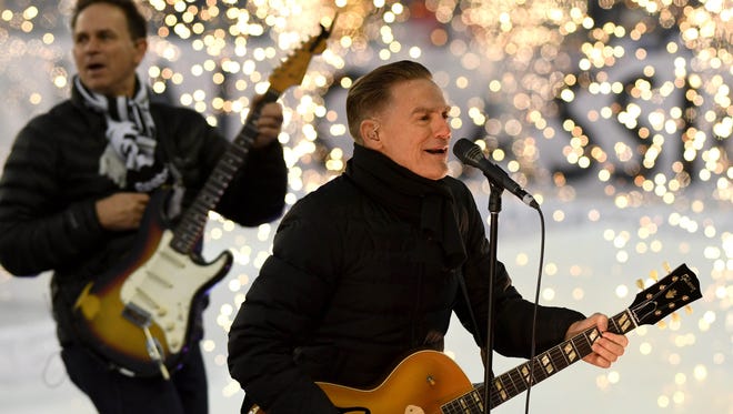 Brian Adams performs during the first intermission at the Centennial Classic.