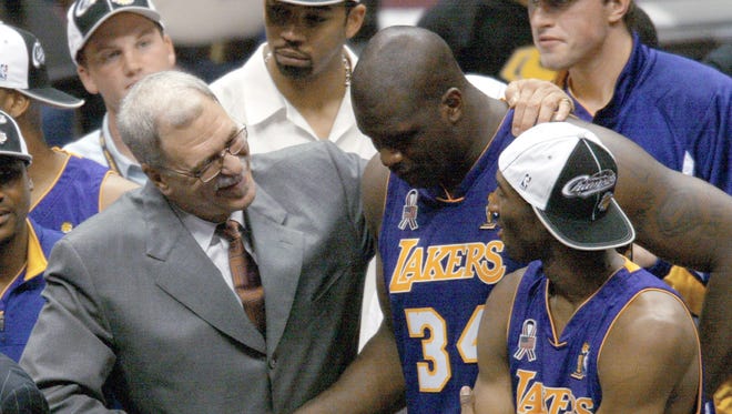 2002: Jackson congratulates Shaquille O'Neal and Kobe Bryant.