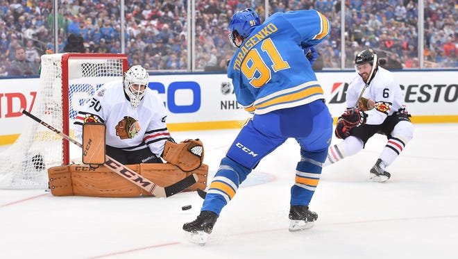 Chicago Blackhawks goalie Corey Crawford (50) makes a save on a shot by St. Louis Blues right wing Vladimir Tarasenko (91) during the second period in the 2016 Winter Classic.