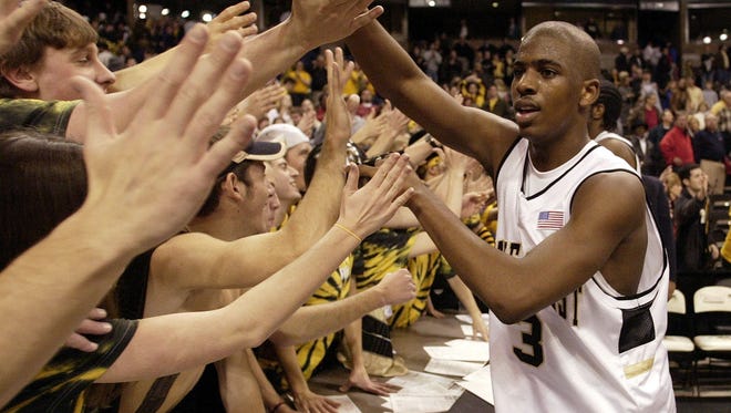 2004: Wake Forest's Chris Paul, right, gives high fives to cheering students.