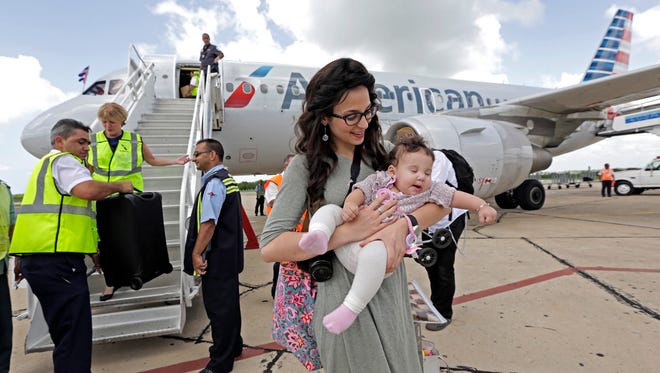 Miriam Turner arrives with her baby Chana, 7 months, in Cienfuegos, Cuba, on American Airlines inaugural scheduled service from Miami to Cuba on Sept.7, 2016.
