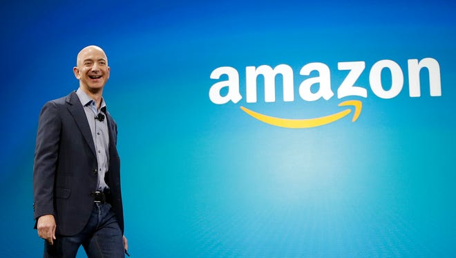 Amazon CEO Jeff Bezos walks onstage in Seattle for the launch of the new Amazon Fire Phone.