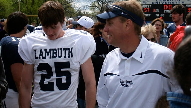 Lambuth University head coach Hugh Freeze (right) talks to fans after the team's spring game April 12 in Jackson, Tenn.