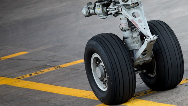 The nose gear of a British Airways Boeing 747 rolls up to the stop line at the gate at  Denver International Airport on May 7, 2017.