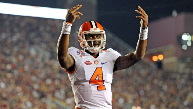 Clemson quarterback Deshaun Watson (4) makes a signal to the crowd after a touchdown against Florida State.