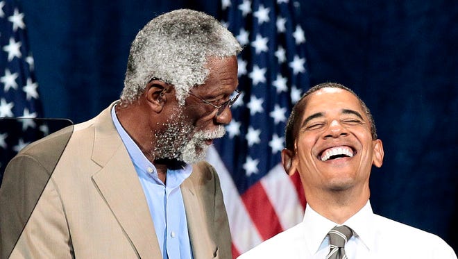 President Barack Obama smiles as he is introduced by Hall of Famer Bill Russell during a Democratic fundraiser at the Paramount Theater, Sunday, Sept. 25, 2011, in Seattle.