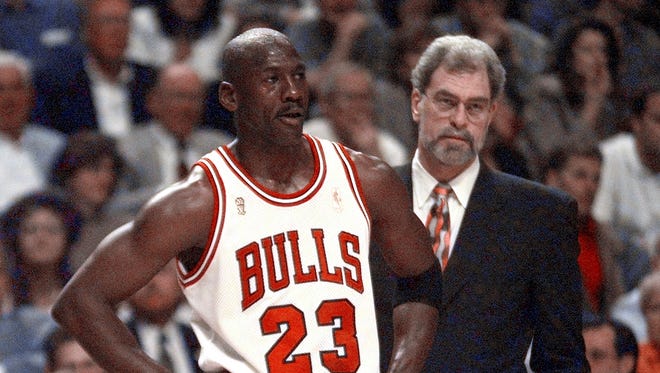 1997: Michael Jordan and Jackson look on.