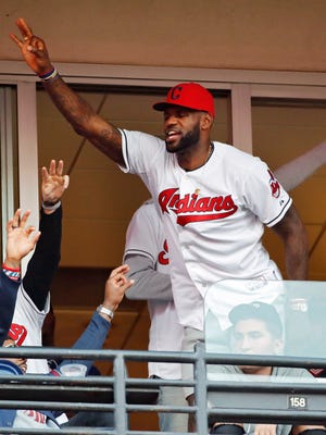 Cleveland Cavaliers' LeBron James stands during the seventh inning in Game 2 of baseball's American League Championship Series between the Cleveland Indians and the Toronto Blue Jays in Cleveland.