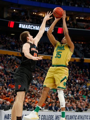 Notre Dame Fighting Irish forward Bonzie Colson (35) shoots over Princeton Tigers forward Will Gladson (13) in the second half during the first round of the NCAA Tournament at KeyBank Center.