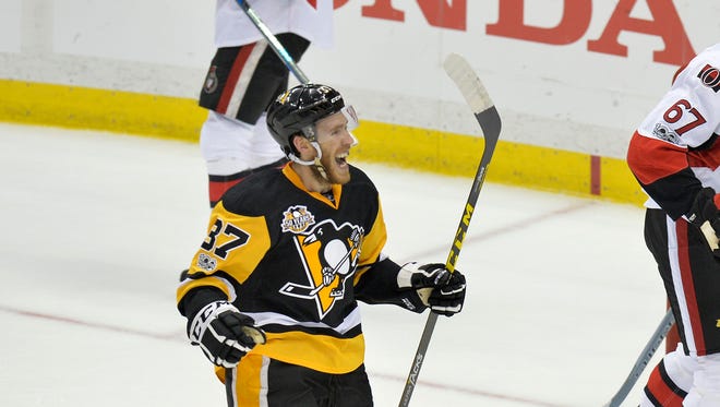Pittsburgh Penguins forward Carter Rowney (37) celebrates after the Penguins scored a goal against the Ottawa Senators during the first period in Game 5.