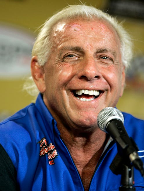 In 2007, Ric Flair addresses the media during a news conference at Dover International Speedway in Dover, Del.