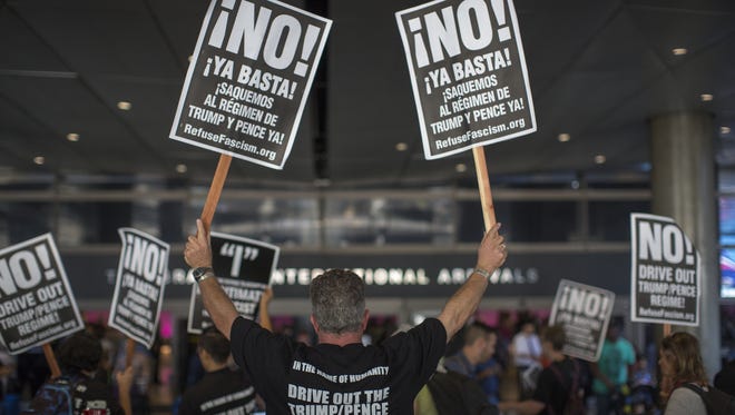 Activists protest on the first day of the the partial reinstatement of the Trump travel ban at Los Angeles International Airport (LAX.)