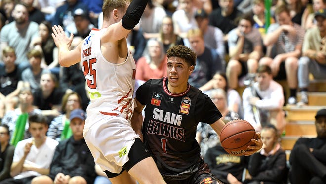 LaMelo Ball tries to get past a Perth player in a preseason game last week.