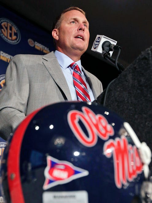 Mississippi coach Hugh Freeze talks with reporters during the Southeastern Conference football Media Days in Hoover, Ala., Tuesday, July 16, 2013. (AP Photo/Dave Martin)