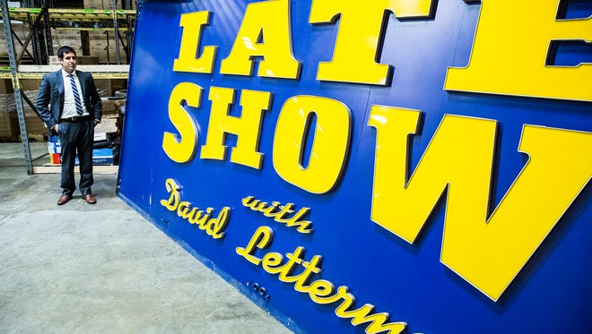 Michael Szajewski, head of archives for Bracken Library at Ball State University, visits the Late Show marquee housed in a storage facility off campus.