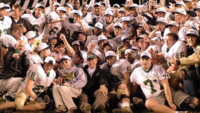 The 2004 Division 2-AA state champ Briarcrest Christian School football team celebrate with head coach Hugh Freeze and team manager Brent Frayser (center) following the Saints 24-0 Division 2-AA state title game victory over ECS at Vanderbilt Stadium in Nashville.


12/05/04 ran cordova