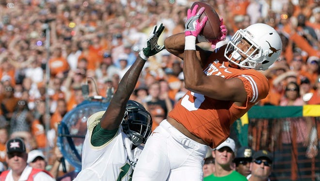 Texas wide receiver Colin Johnson (9) attempts to bring in a ball against Baylor.
