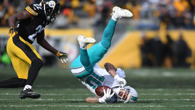 Jan 8, 2017; Pittsburgh, PA, USA; Miami Dolphins wide receiver Kenny Stills (10) catches a pass in front of Pittsburgh Steelers cornerback William Gay (22) during the first half in the AFC Wild Card playoff football game at Heinz Field. Mandatory Credit: James Lang-USA TODAY Sports ORG XMIT: USATSI-355490 ORIG FILE ID:  20170108_ads_sj8_052.JPG