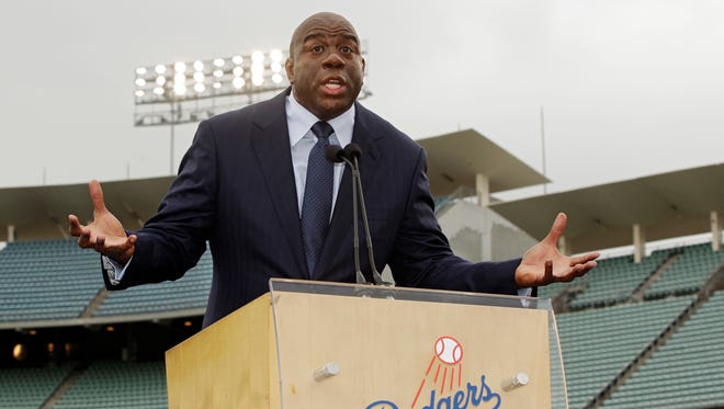 2012: Magic Johnson speaks during a news conference at Dodger Stadium in Los Angeles.
