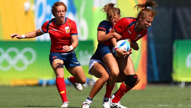 France back Lina Guerin  tackles Spain back Vanesa Rial during a rugby sevens match at Deodoro Stadium during the Rio 2016 Summer Olympic Games.