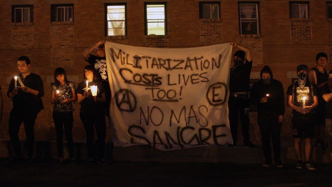 Protesters in El Paso held a candlelight vigil in June 2010 following the cross-border killing of a Mexican teenager by a U.S. Border Patrol agent.