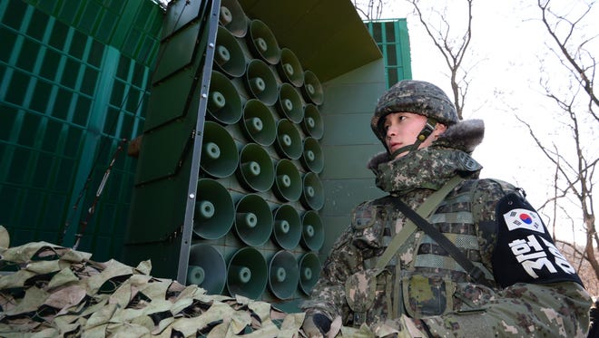 An undated photo made available on Feb.16, 2017 shows a South Korean soldier standing near loudspeakers at the border with North Korea, at an undisclosed location in South Korea.