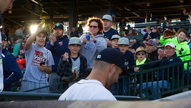 April 6: Fans cheer as Tim Tebow walks into the dugout prior to the start of the game against the Augusta GreenJackets.