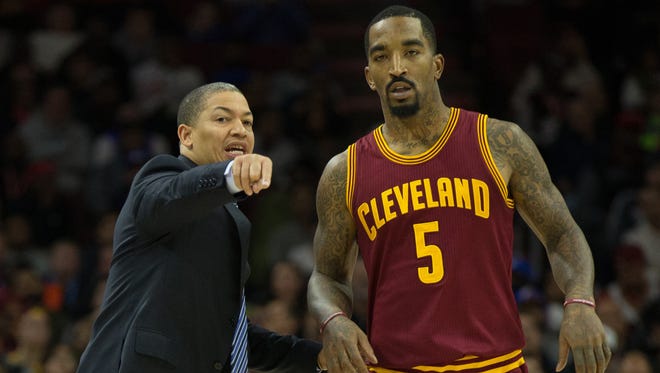 Cleveland Cavaliers head coach Tyronn Lue talks with guard J.R. Smith (5) during the fourth quarter against the Philadelphia 76ers at Wells Fargo Center.