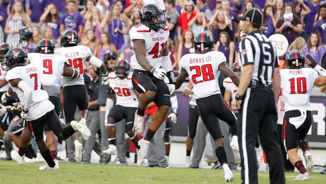 Texas Tech linebacker Malik Jenkins (41) celebrates TCU's missed field goal in the second overtime. Texas Tech would hit their own field goal for the victory.