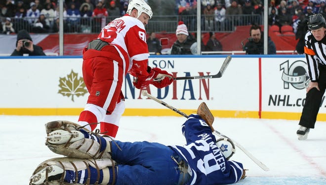 Maple Leafs goalie Mike Palmateer (29) saves a penalty shot attempt by Red Wings forward Tomas Holmstrom (96) during the Centennial Classic Alumni Game.