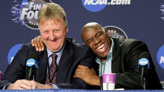 2009: Former NBA players Earvin "Magic" Johnson, right, and Larry Bird share a laugh at a news conference before the championship game between Michigan State and North Carolina.