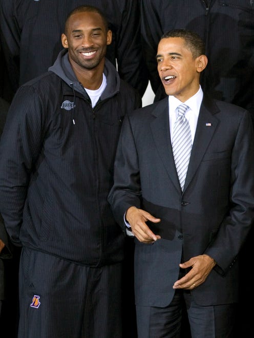 President Barack Obama poses for photographs with the Los Angeles Lakers, including guard Kobe Bryant, during an event to honor the NBA champions in Washington, Monday, Dec. 13, 2010, at the Boys and Girls Club of Greater Washington.