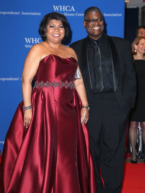 CNN political analyst April Ryan, left, and guest arrive for the Correspondents' Association event.