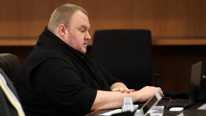 Megaupload founder Kim Dotcom sits in court in Auckland on Sept. 21, 2015, as he fights a U.S. bid to extradite him from New Zealand.