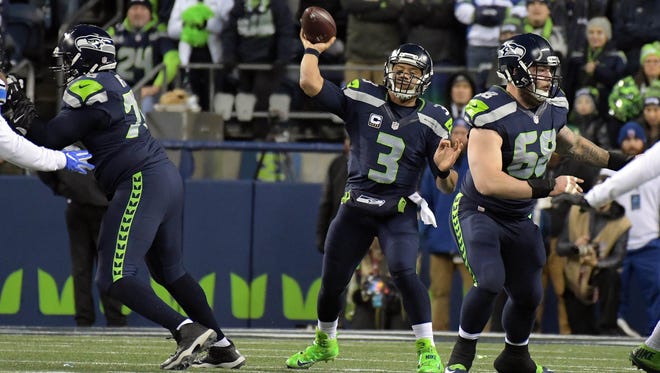 Seattle Seahawks quarterback Russell Wilson (3) throws against the Detroit Lions during the first half in the NFC Wild Card playoff football game at CenturyLink Field.