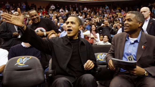 In this Friday, Feb. 27, 2009 file photo, President Barack Obama attends the Washington Wizards game against the Chicago Bulls at the Verizon Center.