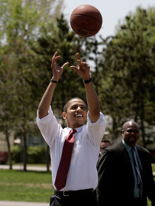 This Sunday, May 4, 2008 file photo shows then Democratic presidential hopeful, Sen. Barack Obama, D-Ill., as he plays basketball at Riverview Elementary School in Elkhart, Ind.