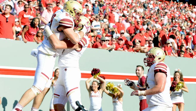 Boston College Eagles  tight end Tommy Sweeney (89) celebrates the game-winning touchdown with teammates during the second half against the North Carolina State Wolfpack at Carter Finley Stadium. Boston College won 21-14.