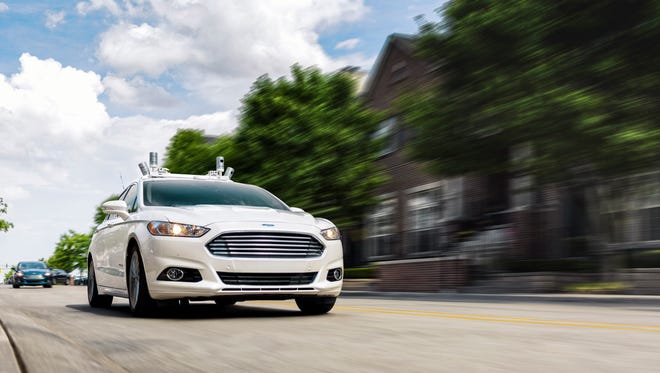 Ford will make a driverless car for ride-sharing purposes by 2021, using its Ford Fusion Hybrids (shown here) as technology test mules.