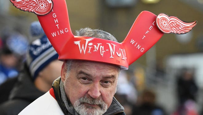 Detroit Red Wings fan sports head gear to support his team.