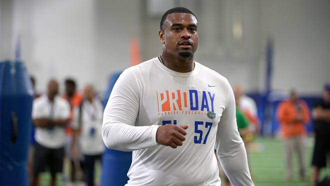 Defensive lineman Caleb Brantley (57) rests after running through a drill during Florida's NFL Pro Day in Gainesville, Fla., Tuesday, March 28, 2017.