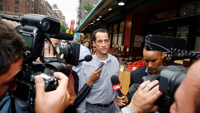 Weiner is questioned by the media near his home in Queens on June  11, 2011. The then-congressman acknowledged the day before that he had online contact with a 17-year-old girl from Delaware but said there was nothing inappropriate.